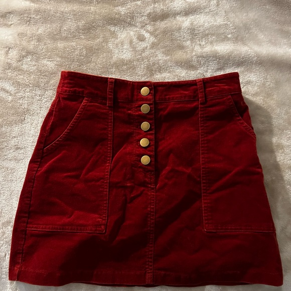 Maroon mini skirt with bronze buttons